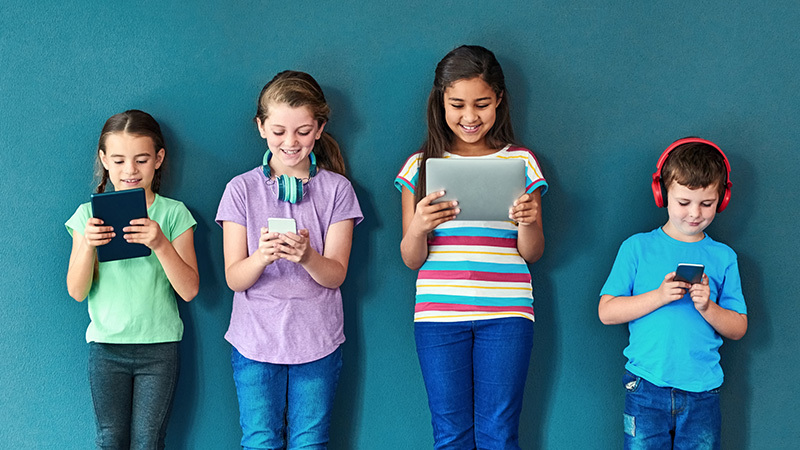 Podcasts for Kids, 4 students with devices